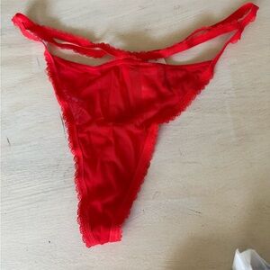 Booty bag red thong size L